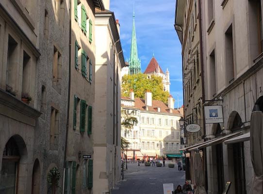 View of the Place du Bourg-de-Four and the Saint-Pierre Cathedral from Etienne-Dumont street in Geneva's Old-Town.