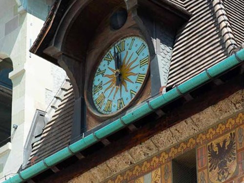 Detail of the Molard tower clock with it's blue dial and golden numbers