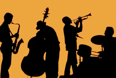 Silhouettes noires de musiciens sur fond orange